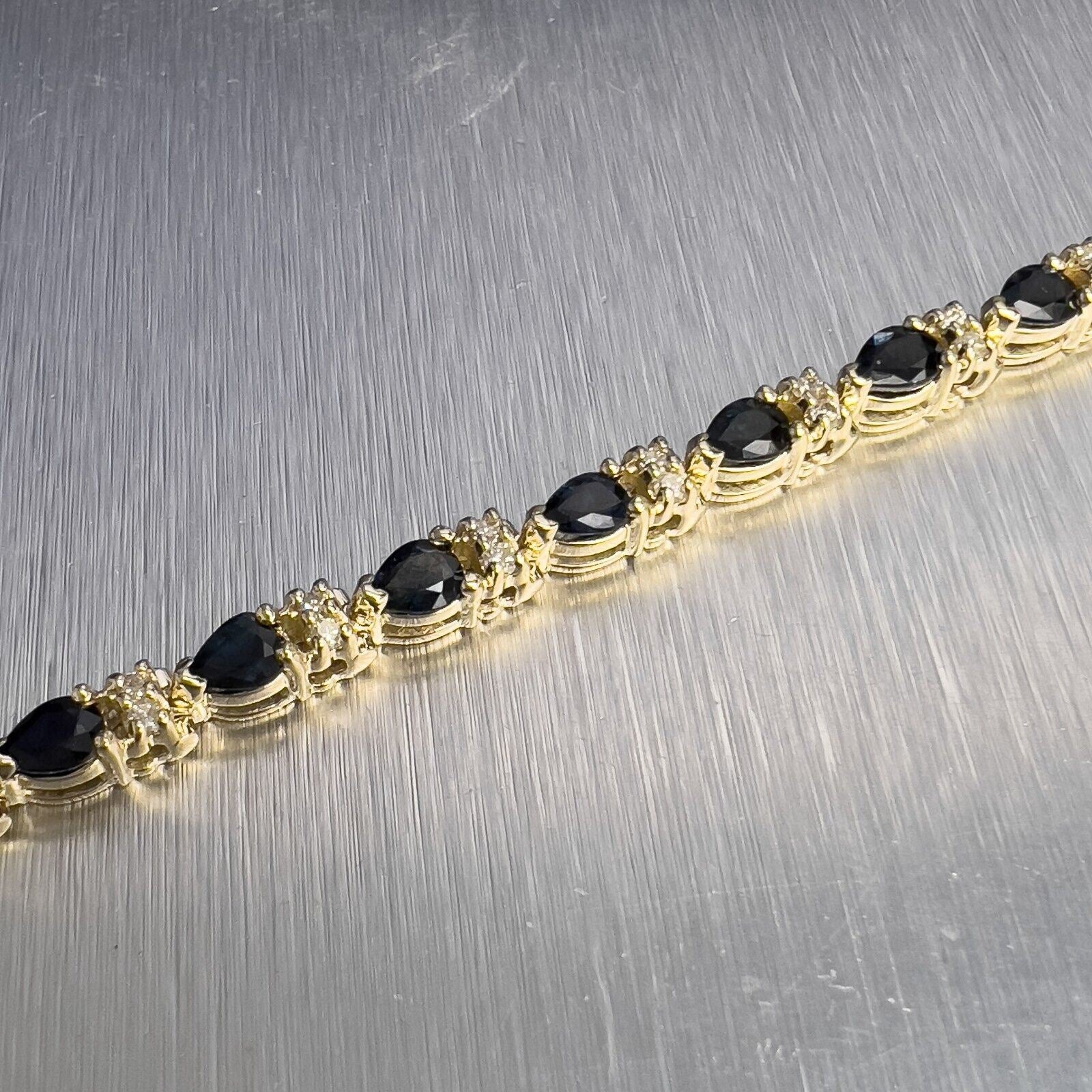 14k Yellow Gold 3.80ctw Pear Sapphire & 0.45ctw Diamond Tennis Bracelet 7"